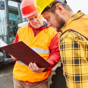 two construction workers reviewing plans