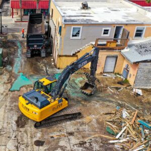 excavator demolishing a building